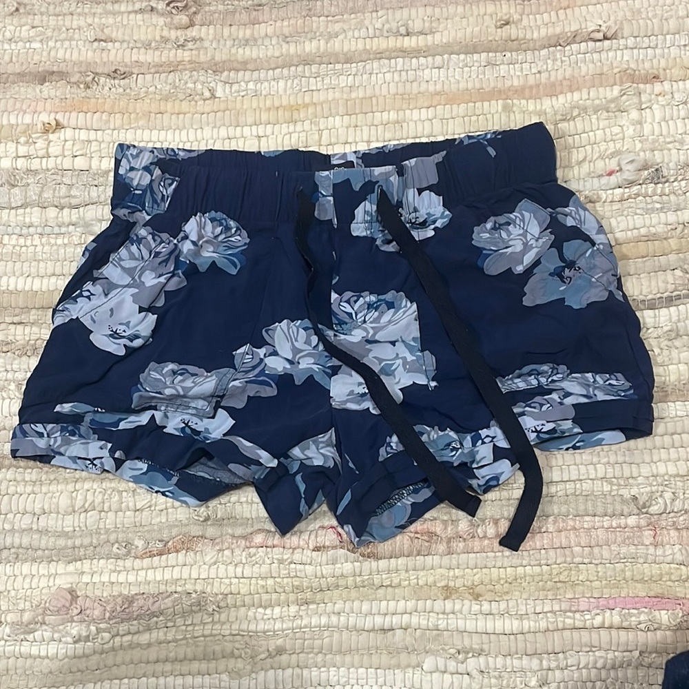 Navy blue floral design shorts.